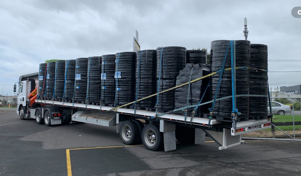 Flatdeck fully loaded with coiled pipe