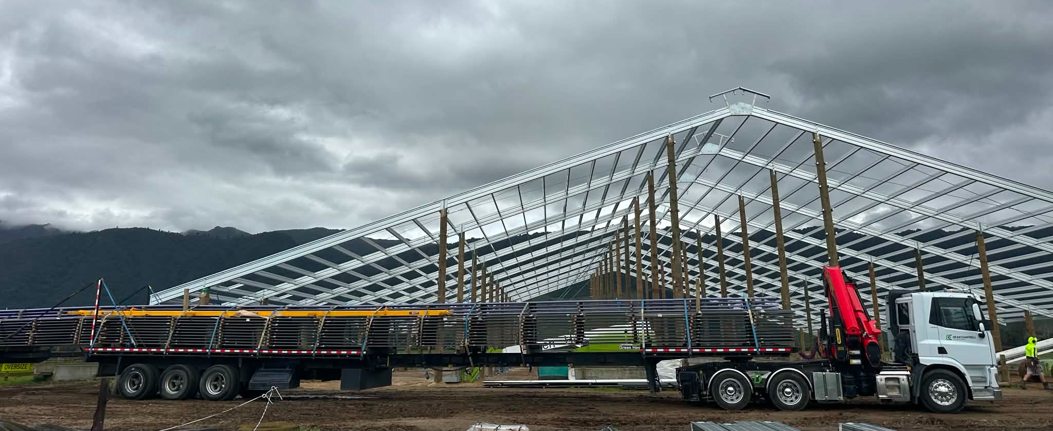 Oversize steel purlins delivered to a shed build