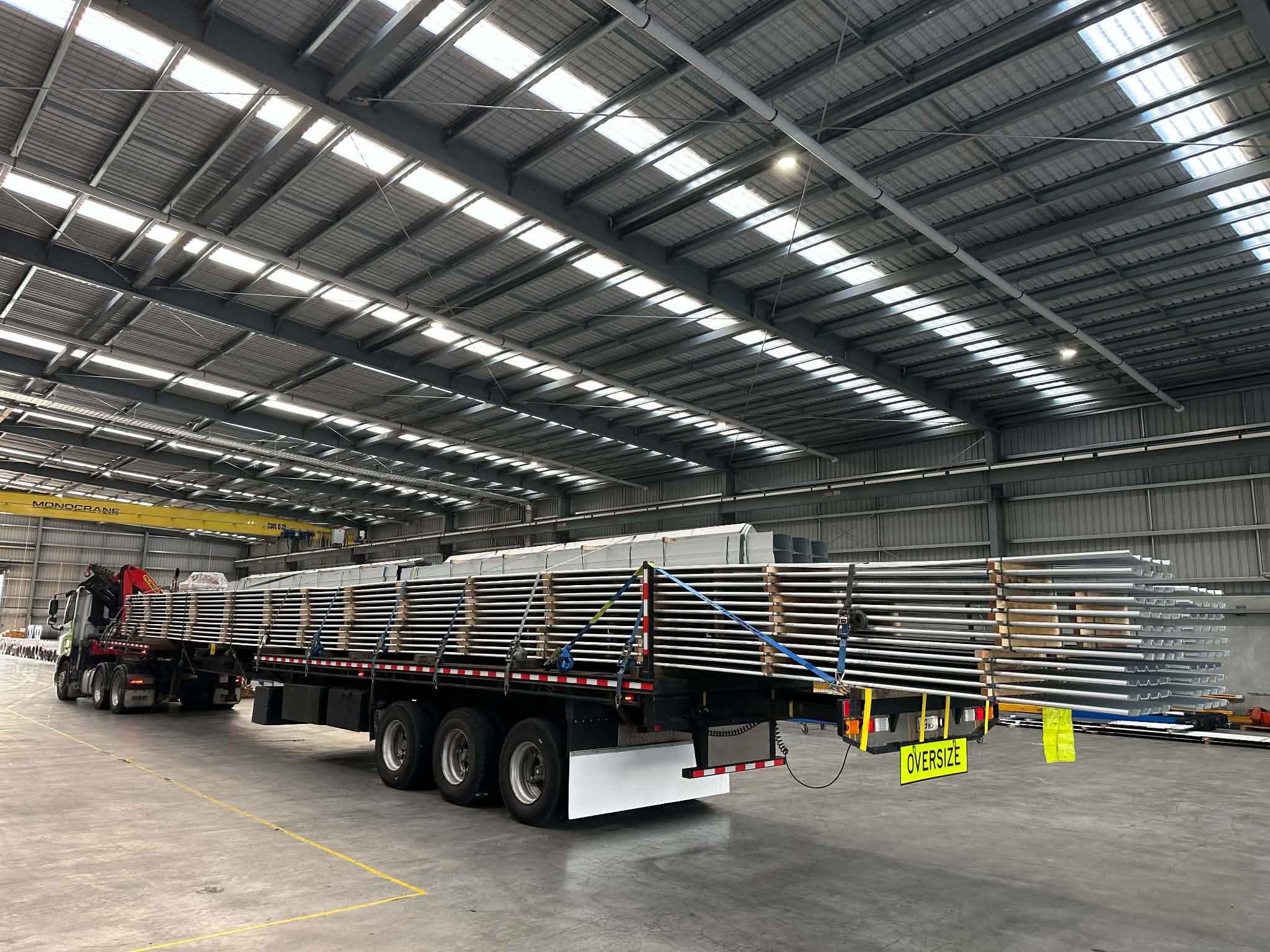 Oversize flatdeck load with warning signage