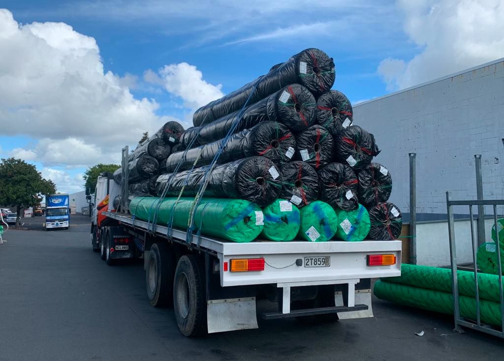 Flatdeck loaded with coiled pipe